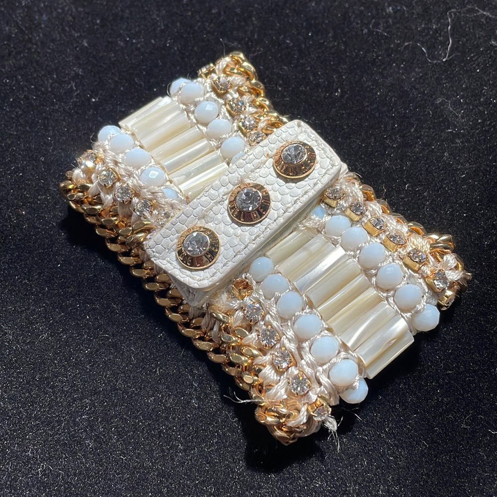 Henri Bendel cuff Bracelet with snap closure.